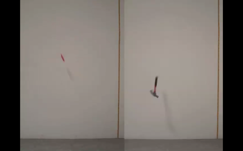 A knife (left) and a hammer (right) are both mid-air in front of a white wall, captured as they fall toward the ground.