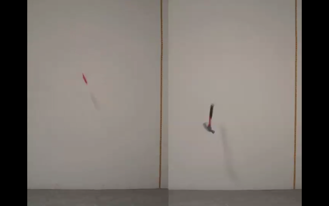 A knife (left) and a hammer (right) are both mid-air in front of a white wall, captured as they fall toward the ground.